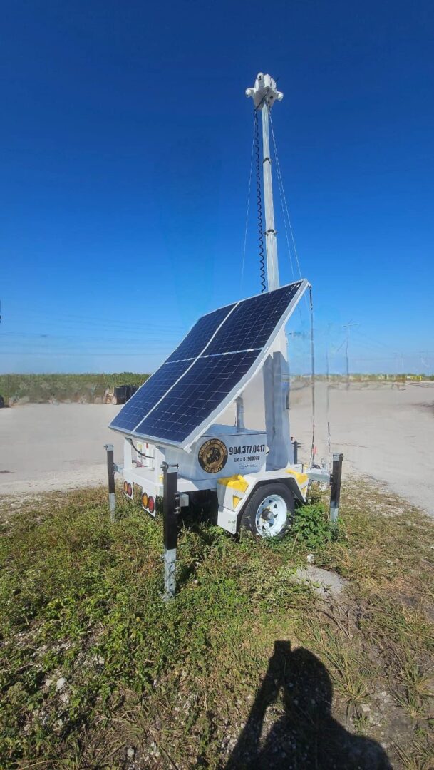 A solar powered light on the side of a road.